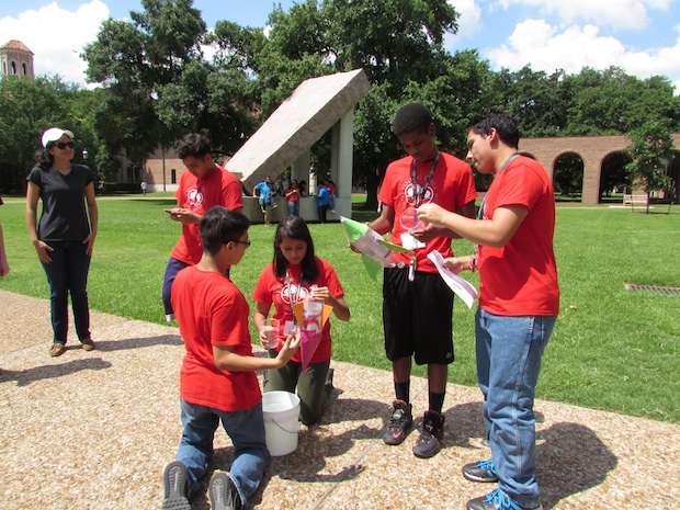 Participants in the Young Owl Leadership Program test an invention in the Engineering Quad.