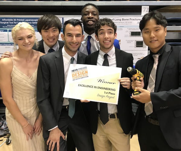 Drill Team Six, from left, won the top prize in the Brown School of Engineering Design Showcase for its invention of a device to help doctors secure rods that keep fractured bones in alignment as they heal. From left, Hannah Jackson, Takanori Iida, Will Yarinsky, Babs Ogunbanwo, Ian Frankel and Byung-UK Kang. (Credit: Rice University)