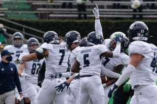 The Owls celebrate during their shutout victory over 15th-ranked Marshall University Dec. 5 in Huntington, W.Va. (RiceOwls.com photo)