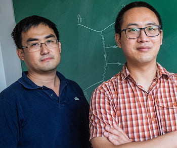 Rice University physics professor Wei Li (left) and postdoctoral research associate Shuai Yang teamed with colleagues at the Large Hadron Collider's (LHC) Compact Muon Solenoid experiment to study matter-generating collisions of light that occurred in heavy ion experiments at LHC. Yang lead-authored a newly published study that detailed how the departure angle of debris from the smashups is subtly distorted by quantum interference patterns prior to impact. The findings will help physicists accurately interpret future experiments aimed at finding "new physics" beyond the Standard Model. (Photo by Jeff Fitlow/Rice University)